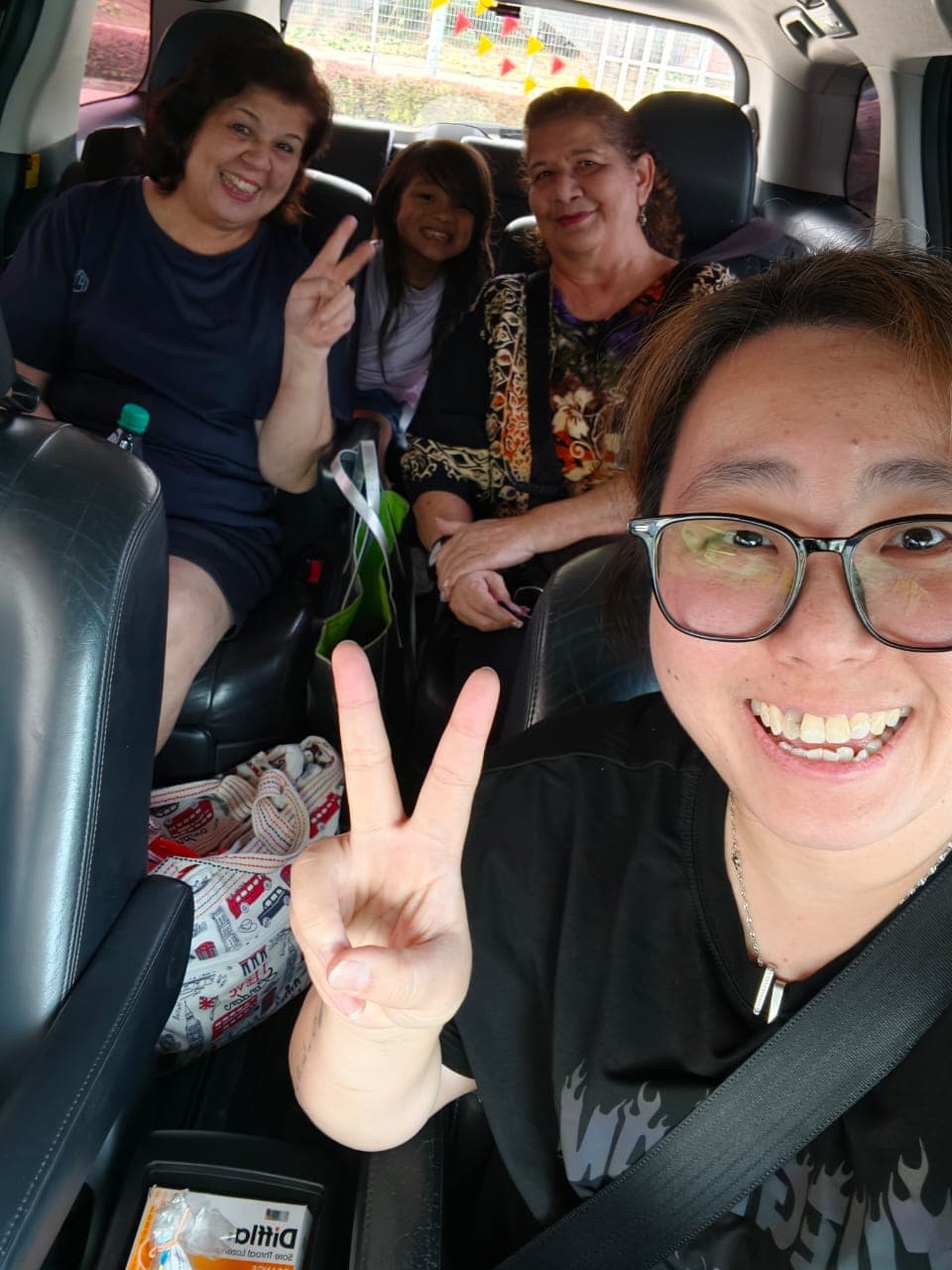Family preparing luggage for a Malaysia to Singapore private MPV return pickup